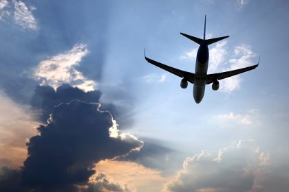 passenger plane flying in clouds