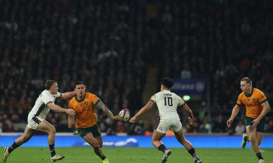 Australia's centre Len Ikitau (2L) passes the ball to the waiting Max Jorgensen (R) before he runs in their late winning try during the Autumn Nations Series International rugby union test match between England and Australia at the Allianz Stadium, Twickenham in south-west London, on November 9, 2024. Australia won the game 42-37. (Photo by Adrian Dennis / AFP) (Photo by ADRIAN DENNIS/AFP via Getty Images)