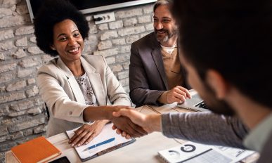 Business recruiters shakes hands with candidate during job inter